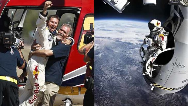 On top of the world ... Felix Baumgartner celebrates after leaping from the edge of space.