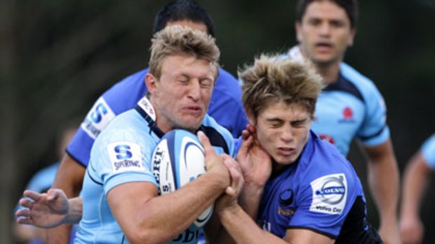 Big hit ... Waratahs speedster Lachie Turner and James O’Connor of the Force clash in last night’s match.