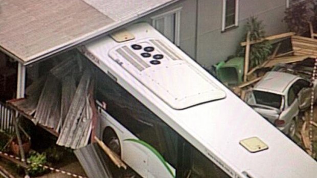 A bus has crashed through the wall of a house in Redland Bay. Photo: Kate Limon/Nine News via Twitter