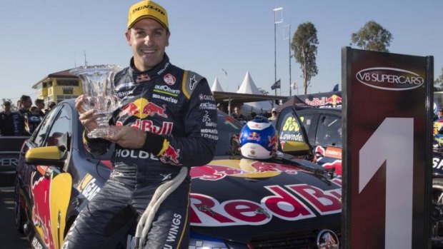 Sweet success: Jamie Whincup celebrates his win in the first of Saturday's races in Ipswich.