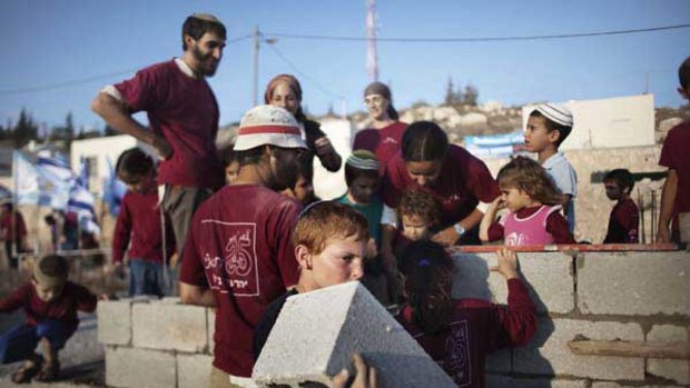 Residents of a West Bank Jewish settlement build housing. <i>Picture:  AFP</i>