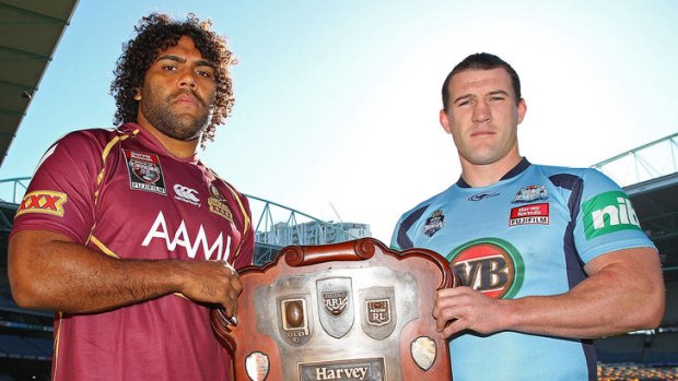 Queensland's Sam Thaiday  and NSW captain Paul Gallen pose with the State of Origin Shield at Etihad Stadium, Melbourne, yesterday.