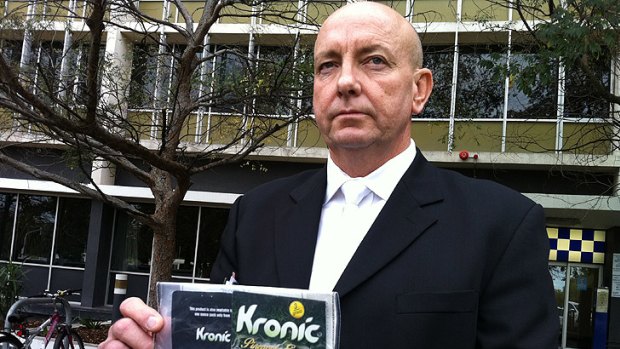 Detective Senior Sergeant Glenn Swannell holds a bag of Kronic that police allegedly seized from a 30-year-old Albany man.