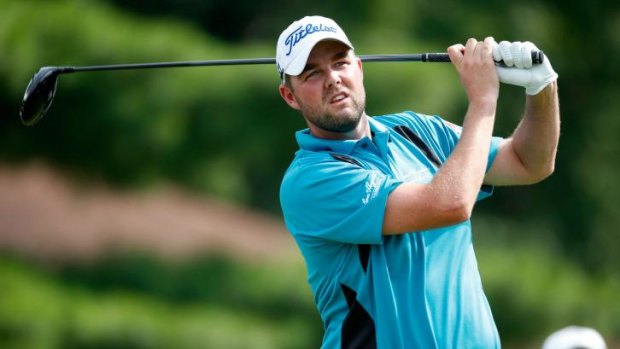 Marc Leishman hits off the eighth tee during the final round of the Bridgestone Invitational .