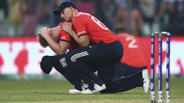 Joe Root consoles Ben Stokes after the final over.