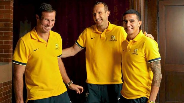 Not without a fight: Lucas Neill, left, with Mark Schwarzer and Tim Cahill.
