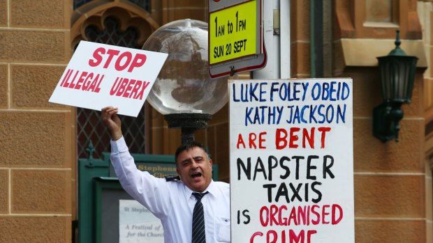 A taxi driver protesting against Uber at the NSW State Parliament on Thursday. 