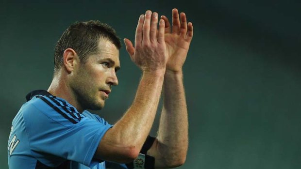 Gulf in class ... Sydney FC's Brett Emerton applauds the crowd after the round two A-League match against Brisbane.