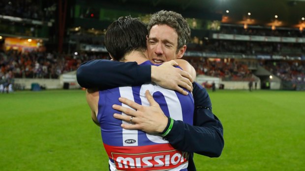 Emotional: Injured Bulldogs skipper Bob Murphy embraces his stand-in, Easton Wood, after the game.