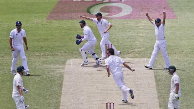 England celebrates Shane Watson's wicket yesterday.
