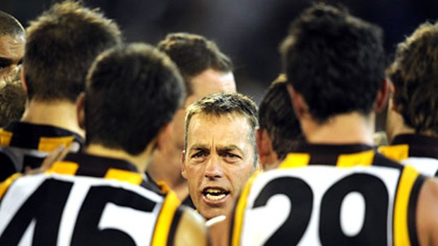 Coach Alastair Clarkson tries to fire up his players at quarter-time of Saturday's anticipated clash with Hawthorn.