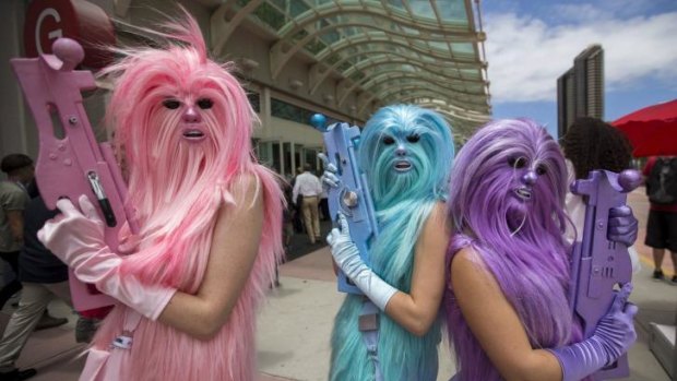 Star Wars enthusiasts wear costumes resembling what they say are three "Chew's Angels" during the 2015 Comic-Con International Convention in San Diego.