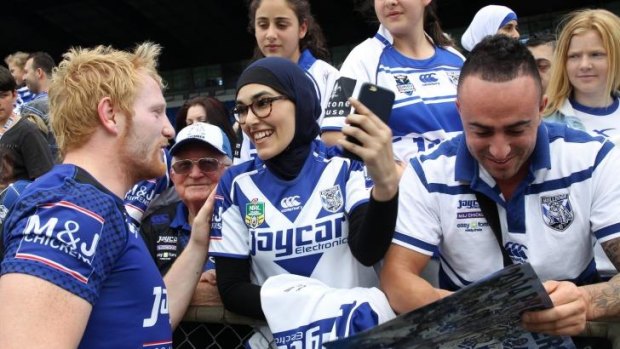 United by their differences: James Graham with supporters at the club’s fan day on Tuesday.