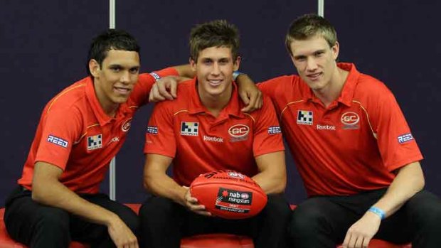 (L-R) Gold Coast Suns new recruits Harley Bennell, David Swallow and Sam Day pose for a photo during the AFL draft.