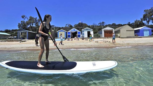 Holidaymakers at Dromana beach enjoy the mild conditions before the heatwave later in the week.