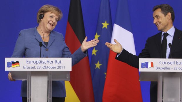 French President Nicolas Sarkozy, right, and German Chancellor Angela Merkel at an EU summit in Brussels.