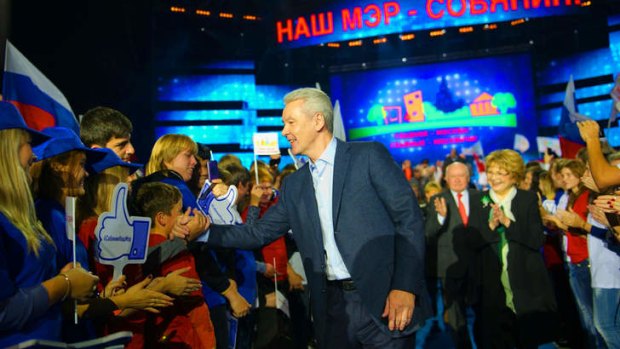 Return to power: incumbent Moscow mayor Sergei Sobyanin (C) meets supporters at his final campaign rally  in Moscow. Early poll results suggest he will be comfortably returned to office.