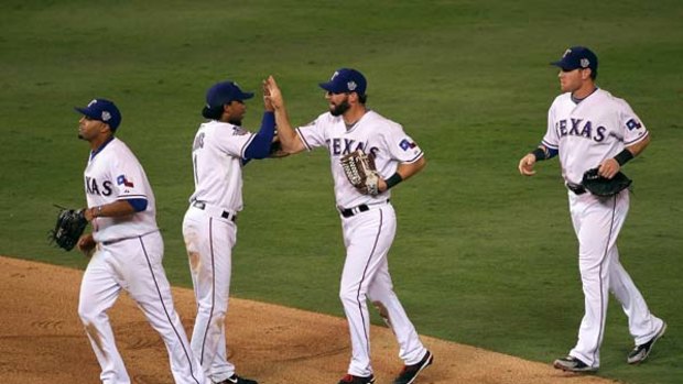 Victorious ... Texas Rangers Nelson Cruz, Elvis Andrus, Jeff Francoeur and Josh Hamilton celebrate their 4-2 win against San Francisco in game three of the World Series.