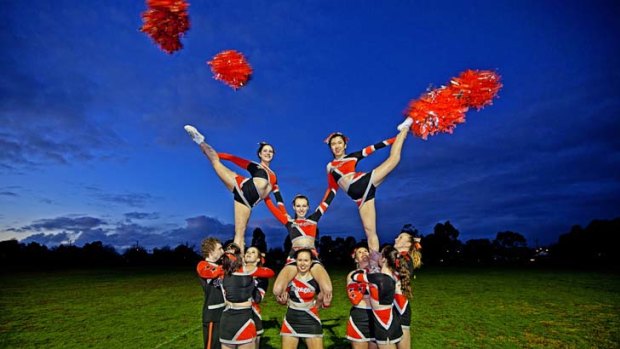 Numbers are climbing: The Wildfire cheerleading team demonstrates some of the physical demands required for a sport that has attracted more than 10,000 participants nationally.