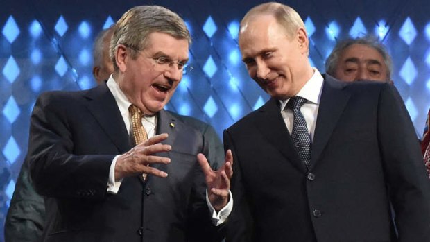 International Olympic Committee President Thomas Bach and Russia's President Vladimir Putin attend the Closing Ceremony of the Sochi Winter Olympics.