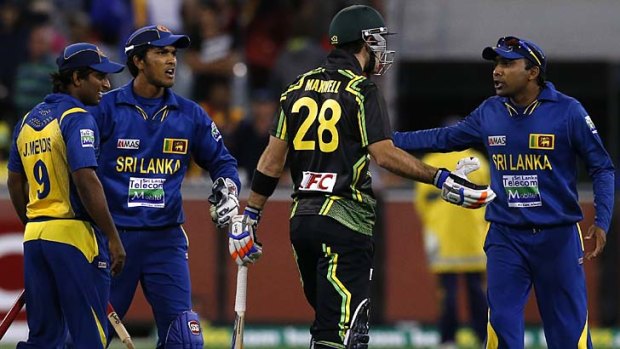 Heated moments ... Sri Lanka's Mahela Jayawardene argues with Glenn Maxwell after the final ball.