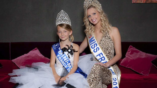 Oceane Scharre, 10, who was voted Mini Miss France in 2011, with that year's Miss France, Mathilde Florin.
