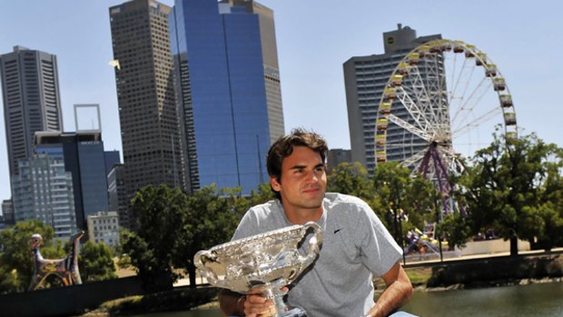 Roger Federer at the Yarra with the singles trophy.