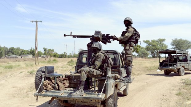 Cameroonian soldiers on patrol in Amchide, 1 km from Nigeria. Around 20 of the dozens of hostages seized by Boko Haram in Cameroon at the weekend were released by the Islamists as they were chased by the army, sources said. 