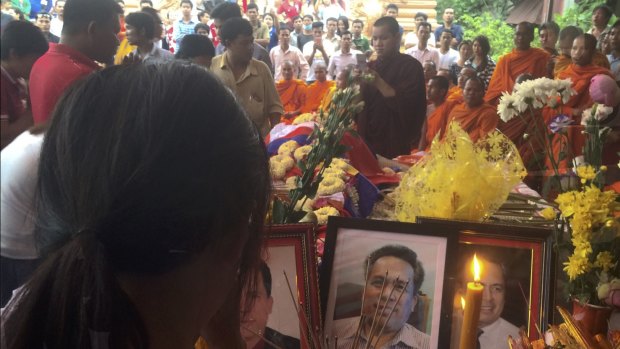 A mourner at the Buddhist funeral rites for commentator Kem Ley. 