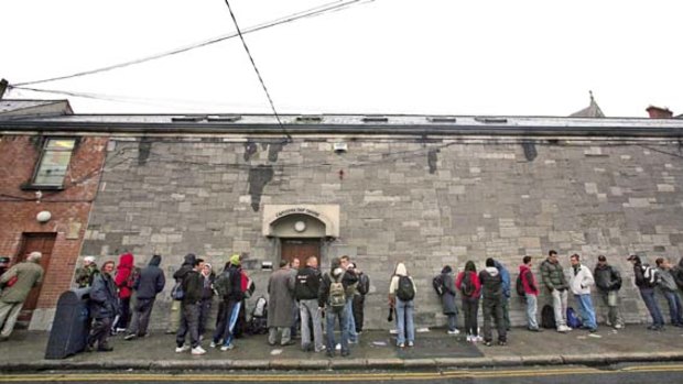 People queue for food at the Capucina Day Centre, in Dublin.