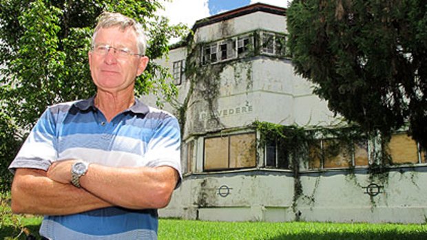 Former Brisbane town clerk and West End resident Tony Philbrick would like to see historical Belvedere (in background) restored to its former glory.
