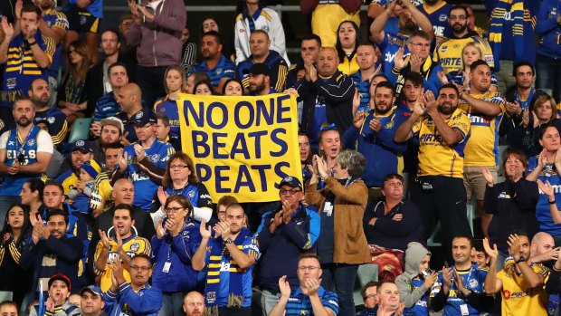 Tribute: Eels fans stood for a minute's applause to show their respect for Nathan Peats, who was forced out to get the club under the salary cap. 