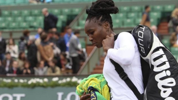 Venus Williams leaves the court after being defeated by 19-year-old Anna Schmiedlova.