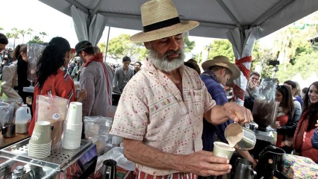 Didn't rain but it poured ... Roberto Orellana and his crew dispensed hundreds of  Mayan coffees at their stall yesterday.