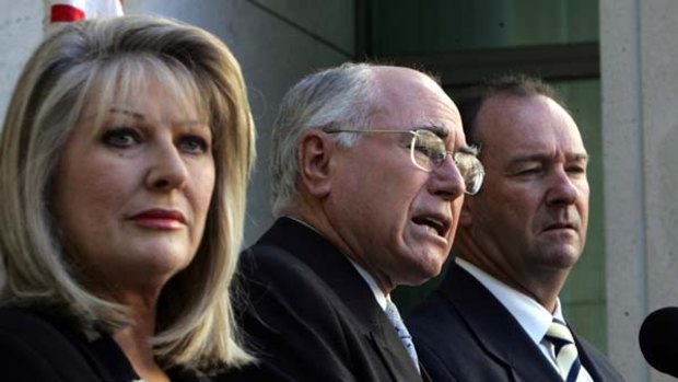 Considered Telstra's request ... Helen Coonan, John Howard and Mark Vaile.