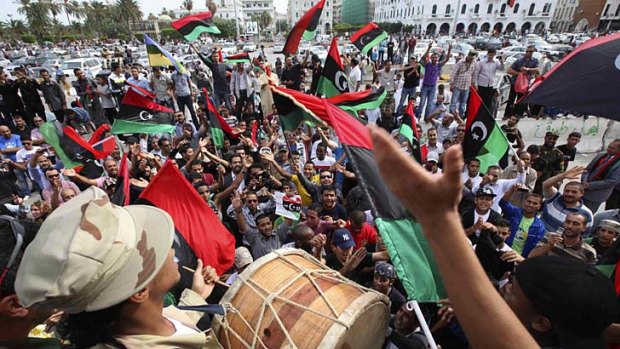 Gaddafi dead ... Libyans celebrate at Martyrs Square in Tripoli.