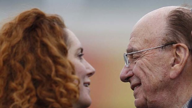 Still in her job ...  Rebekah Brooks, pictured with Rupert Murdoch.