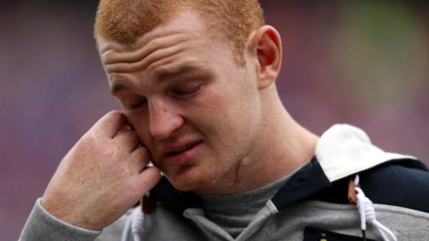 Emotional time: Alex McKinnon wipes away a tear.