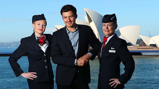 Orlando Bloom with British Airways cabin crew members to launch the airline's new products on the Sydney to London route.