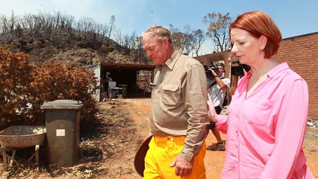 Loss &#8230; Bob Fenwick, whose home near Coonabarabran was gutted, shows the Prime Minister his property on Thursday.