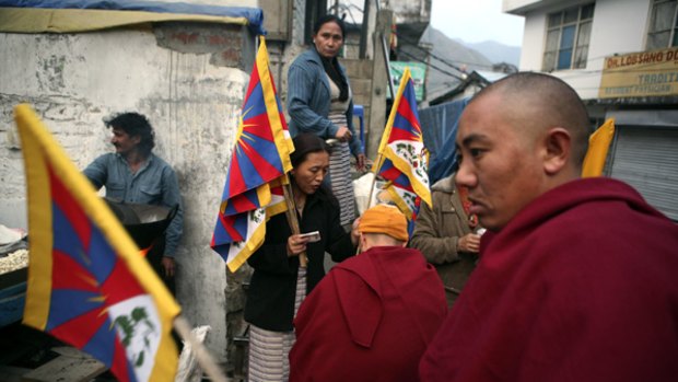 Exiled Tibetans sell Tibetan flags in Dharmsala, India, where the Dalai Lama lives in exile.