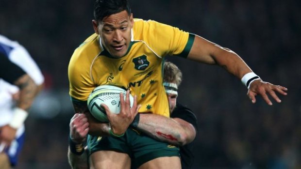 Desperate struggle: Israel Folau is tackled in Auckland.
