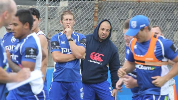 Hood times &#8230; Canterbury coach Jim Dymock watches on as his team begins training at Belmore.