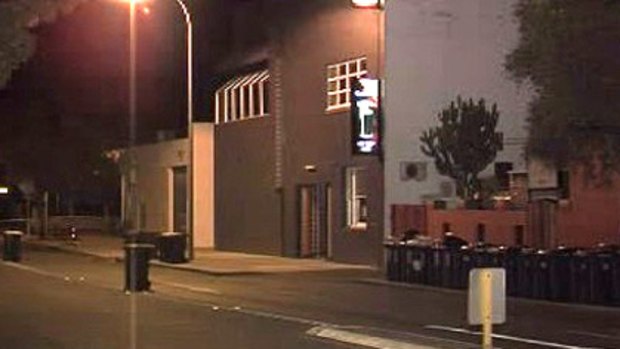 Police tape ropes off the street outside the Irish Club in Perth's Subiaco, where the attack occurred.