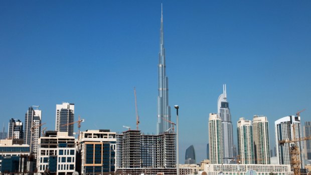 The Burj Khalifa, the world's tallest building, stands against the Dubai skyline.