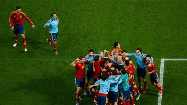 Winners ... Spanish players celebrate reaching the final.
