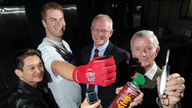 Canberra inventors, with their inventions at the Great Inventors Barbeque. From left: Linh Ho of Lyneham with his medical alert digital watch, Glen Krummel of Fraser with his Stubby Glove, David Dall with his Hopstop anti cane toad spray and Andrey Zoska of Gordon with his mango eating device.