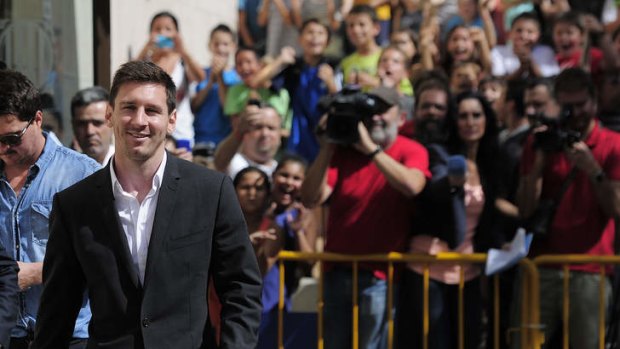 There is no shortage of support for Lionel Messi as he leaves the courhouse in the coastal town of Gava.