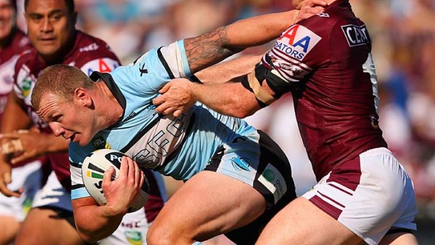 Determined: Luke Lewis and the Sharks put in a strong effort against a confident Manly side.