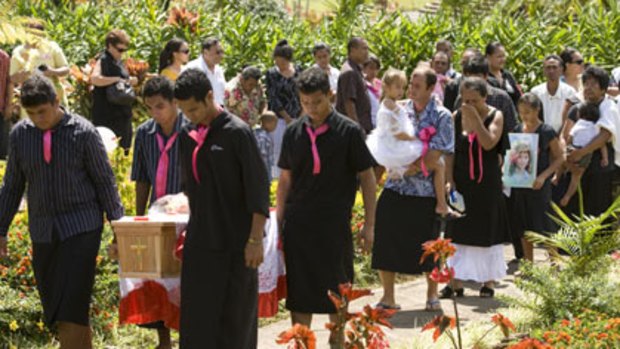Tearful farewell ... Moanalei Long’s grief-stricken parents and one of her sisters  (being carried) walk behind her coffin at a funeral service for the nine-year-old yesterday.